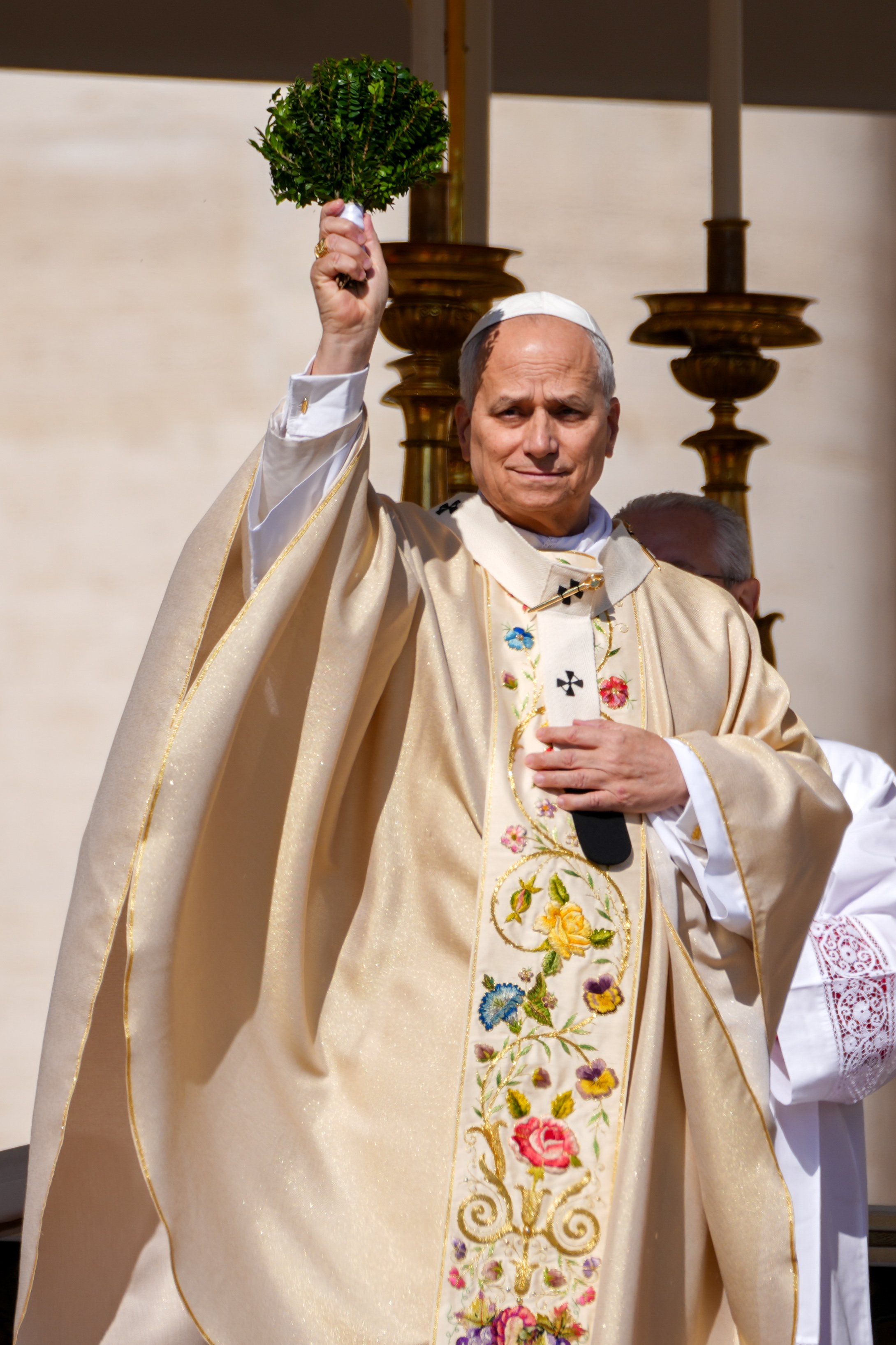 Pope Leo XIV blesses the faithful in St. Peter's Square with holy water during Easter morning Mass at the Vatican April 5, 2026. (CNS photo/Lola Gomez)